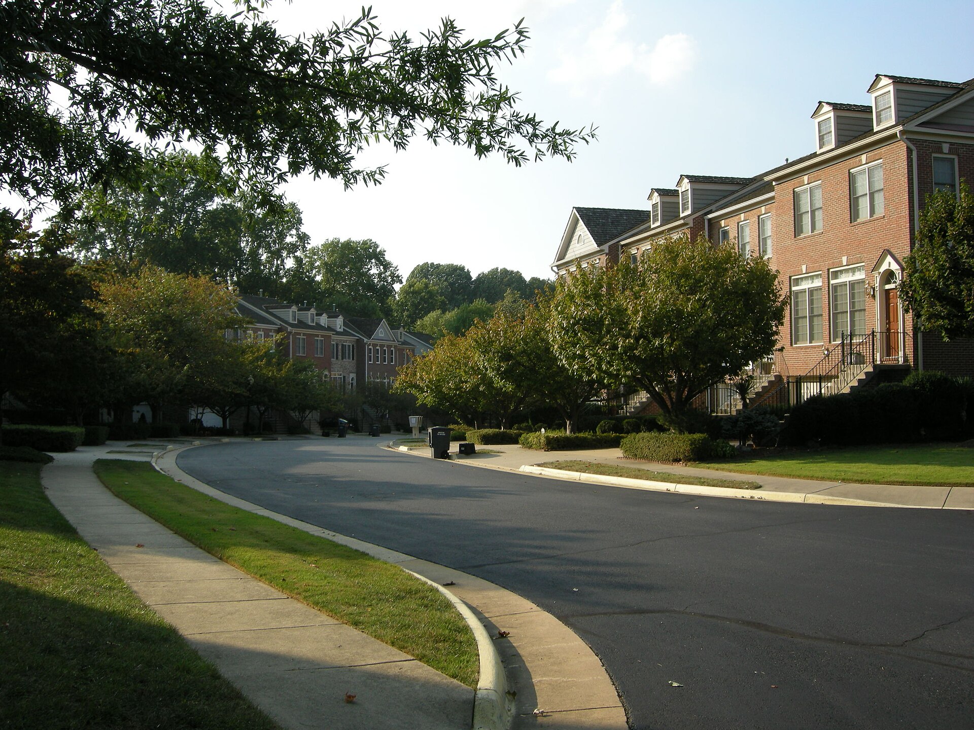 Brick townhouses on a tree-lined street in Oakton, Virginia